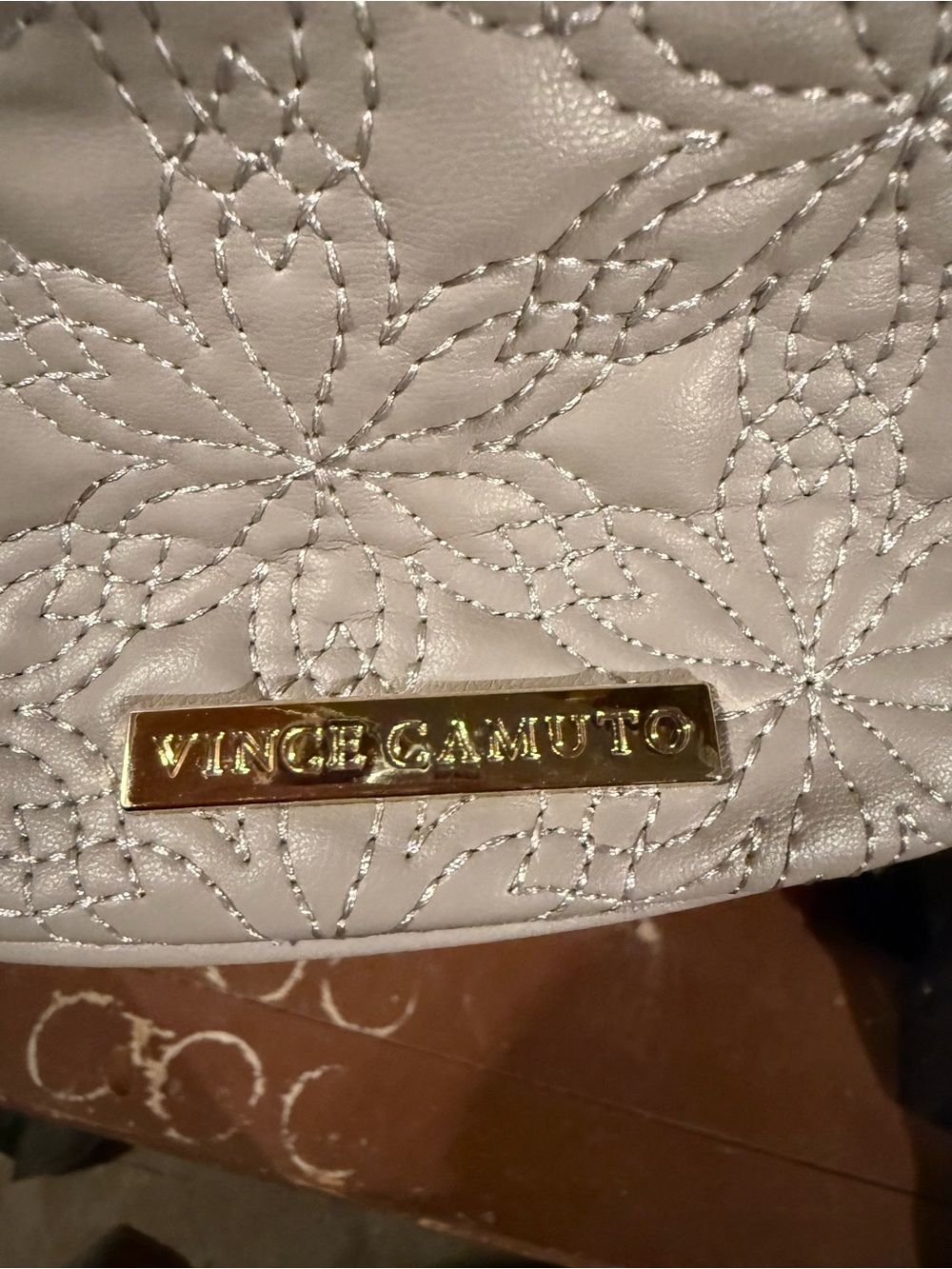 Vince Camuto cream quilted floral crossbody with gold plaque